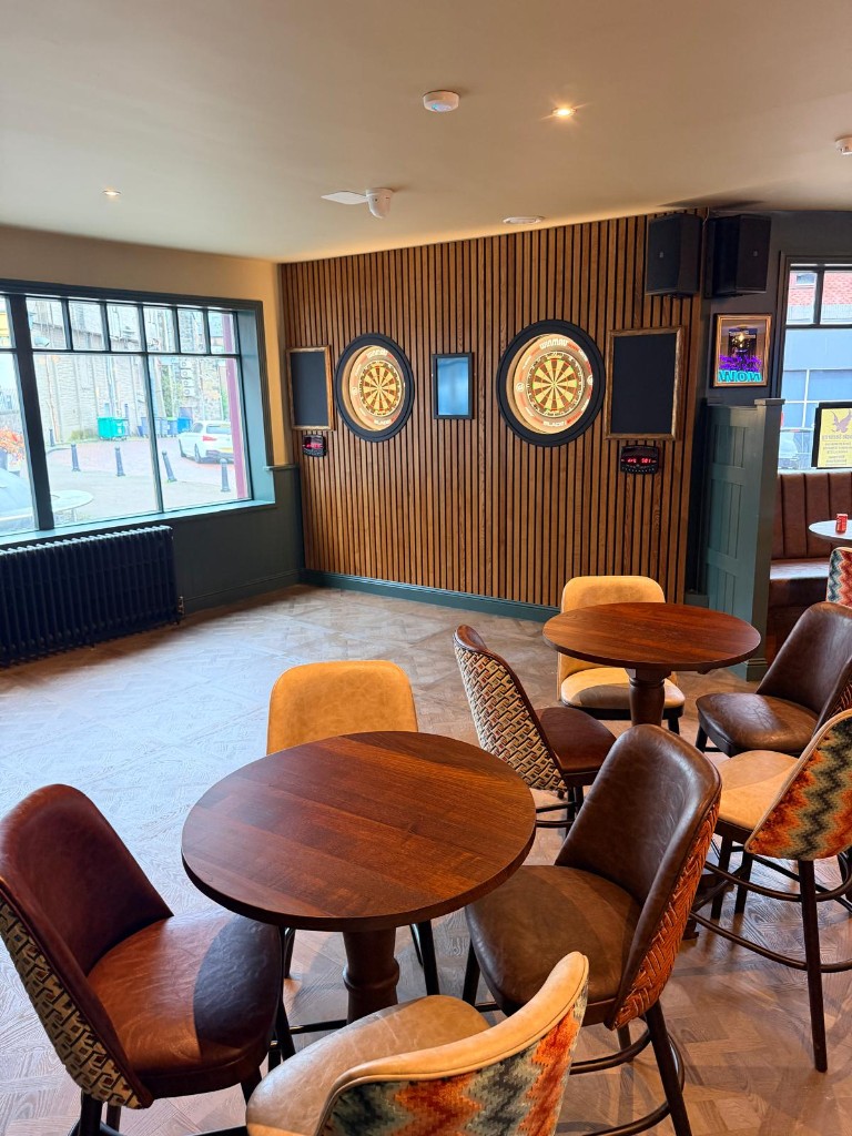 Completed — dartboard feature wall and lounge seating
