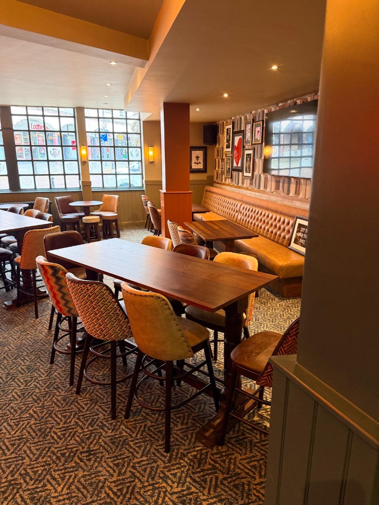 Completed — banquette seating and high-top tables