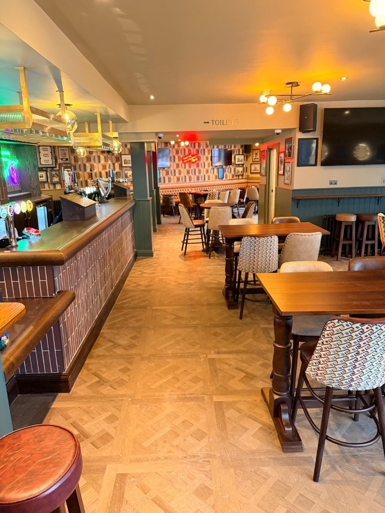 Completed — curved tiled bar front and access hatch